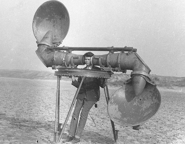 Man with gigantic radar headphones