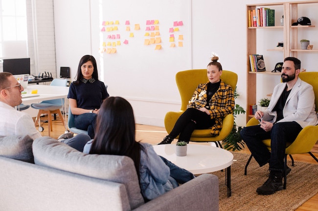 People seating in office around a table